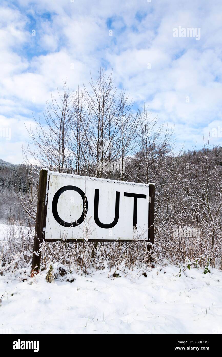 Out sign in snowy landscape, lonely walk in natuer, active lifestyle change concept, mind body soul improvement, winter day Stock Photo