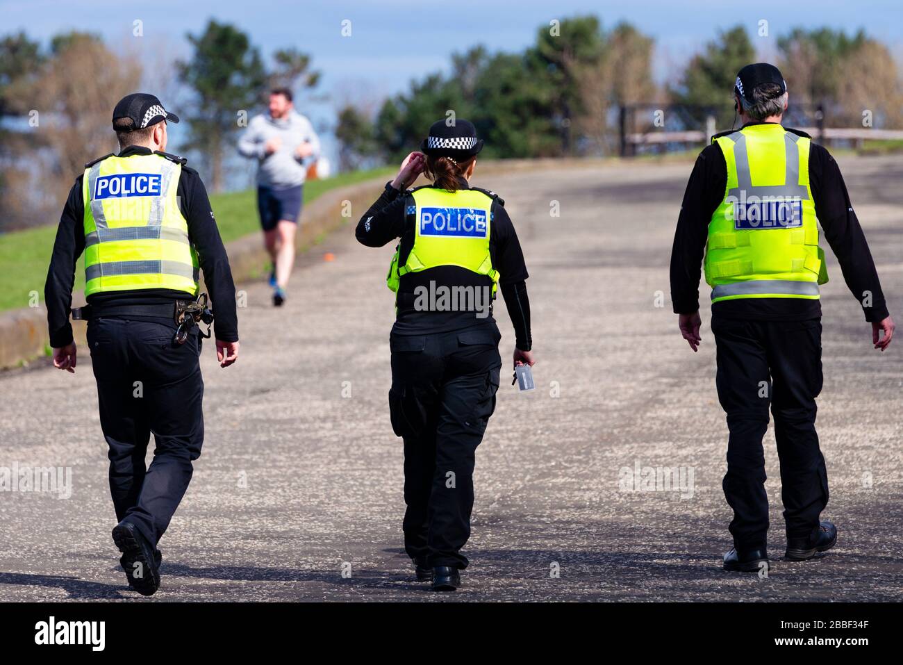Edinburgh, Scotland, UK. 31 March, 2020. Police patrol public parks and walking areas to enforce the coronavirus lockdown regulations about being outdoor. Police patrol at Gypsy Brae recreation ground on waterfront. Iain Masterton/Alamy Live News Stock Photo