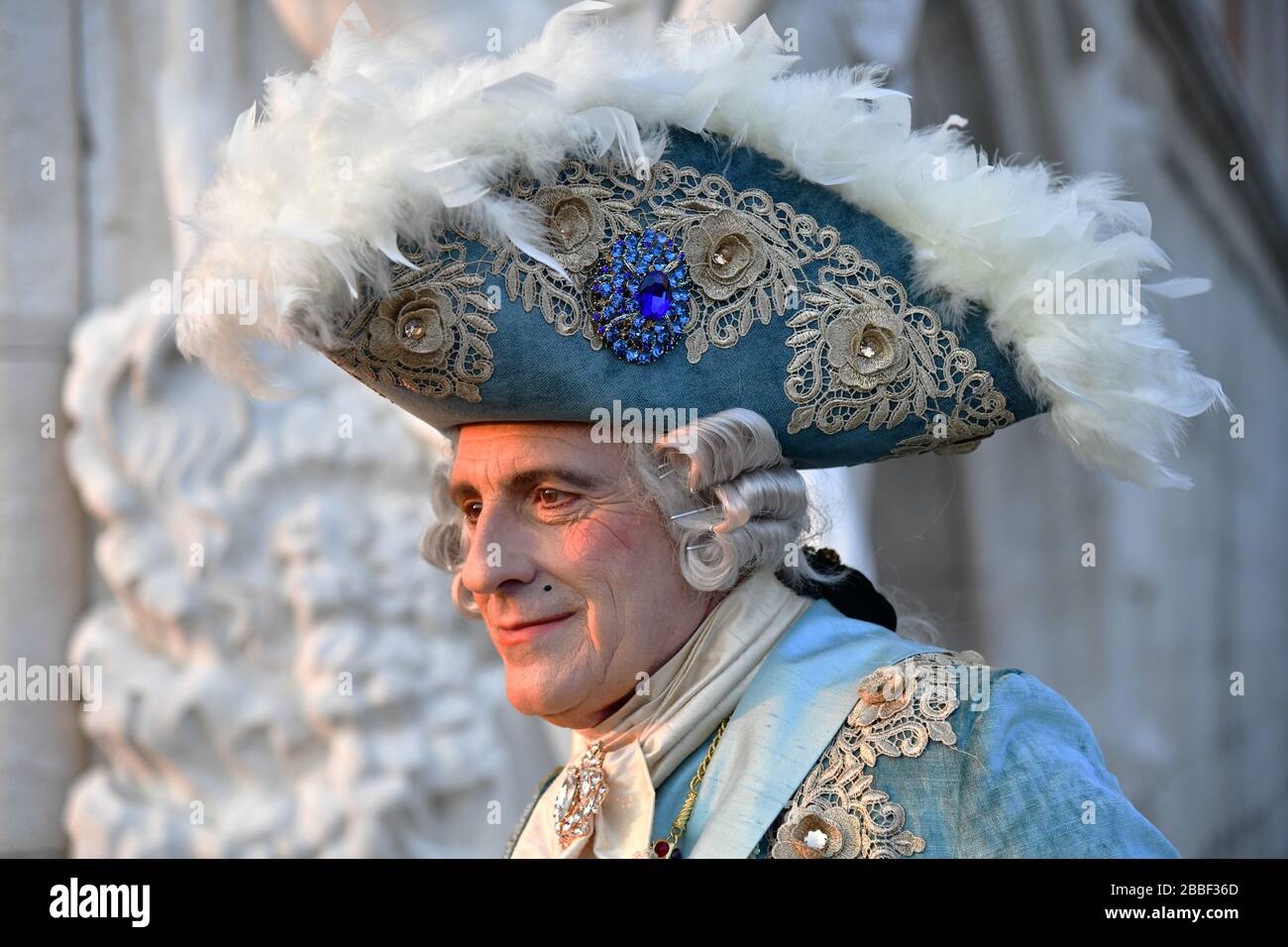 Venice, Italy-February 2020; close up of head of a man in traditional masquerade ball costume for coming carnival Stock Photo