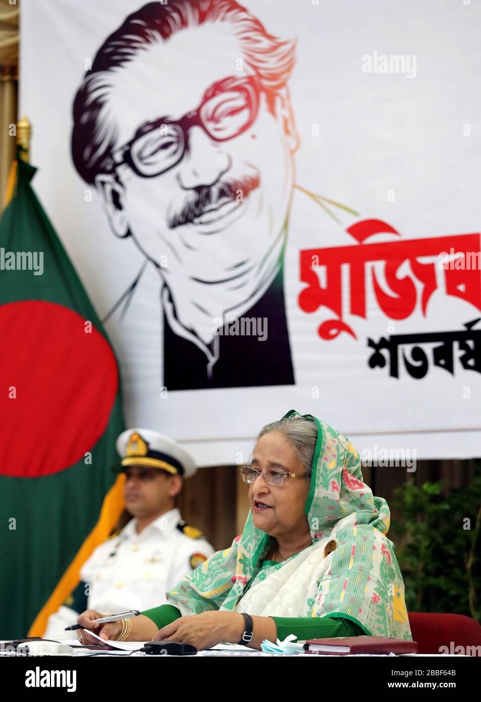 (200331) -- DHAKA, March 31, 2020 (Xinhua) -- Bangladeshi Prime Minister Sheikh Hasina speaks at a video conference from her office in Dhaka, Bangladesh on March 31, 2020. Bangladeshi Prime Minister Sheikh Hasina on Tuesday said the government will extend the ongoing shutdown to manage the spread of COVID-19.    She announced the government's plan while holding a video conference with senior government officials at the country's 64 districts. (PID/Handout via Xinhua) Stock Photo