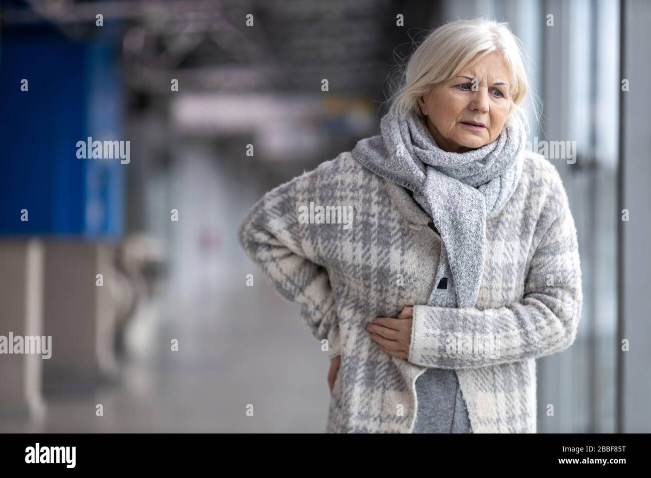 Senior Woman Suffering From Pain Stock Photo