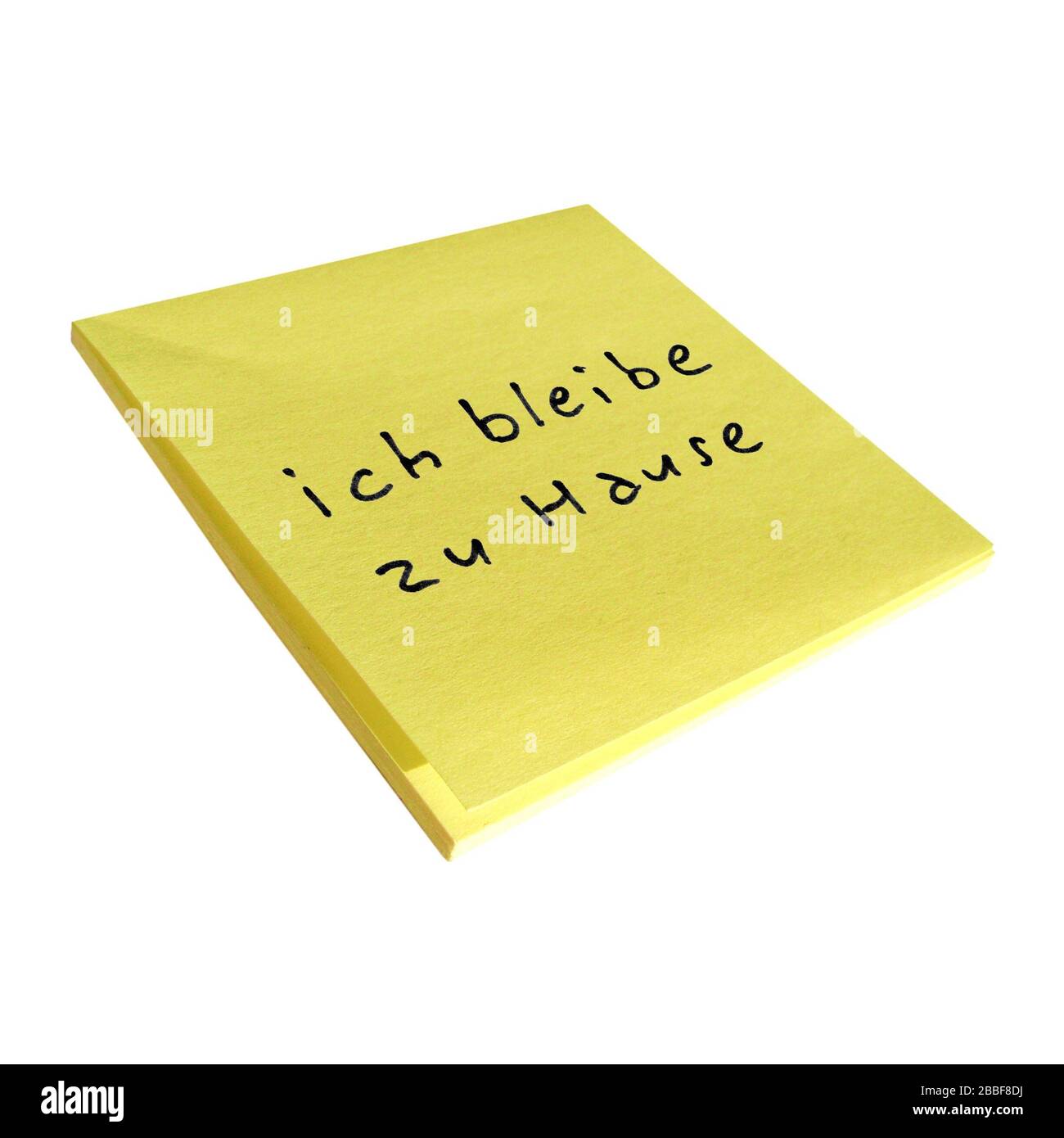 ich bleibe zu Hause (translation: I stay at home) sticky note isolated Stock Photo