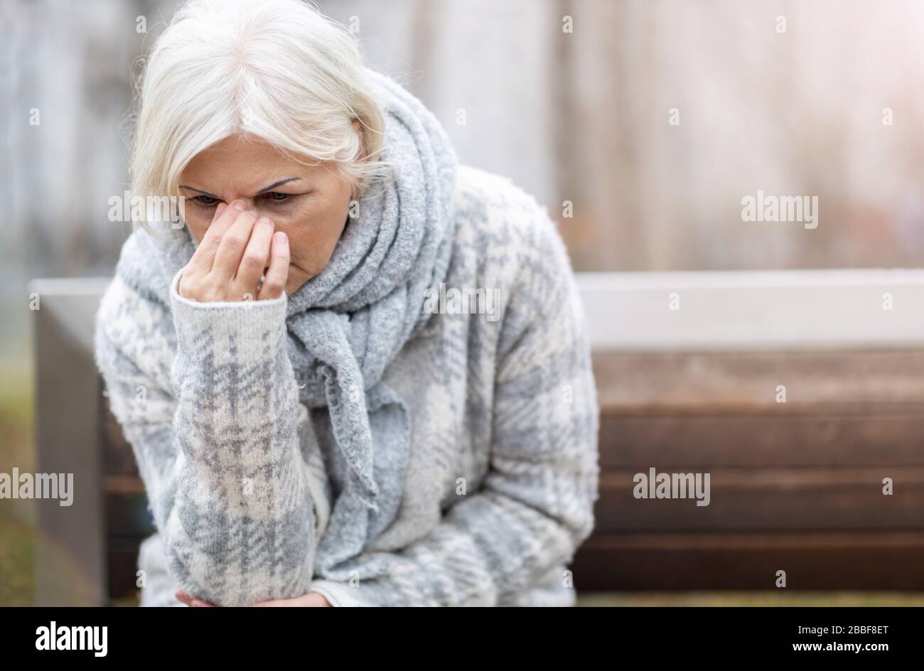 Senior woman suffering from a headache Stock Photo