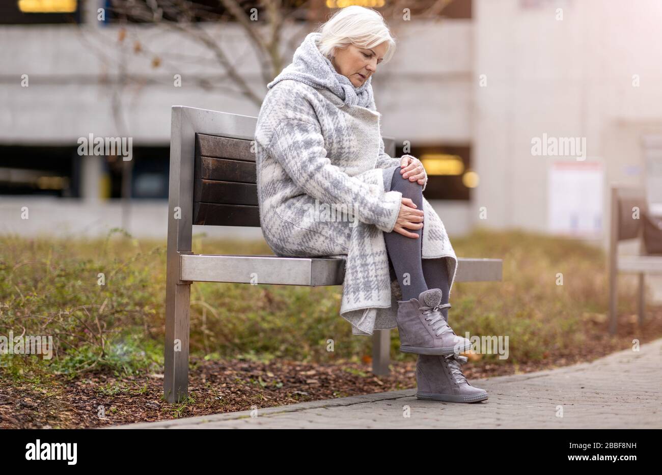Senior Woman Suffering From Pain Stock Photo