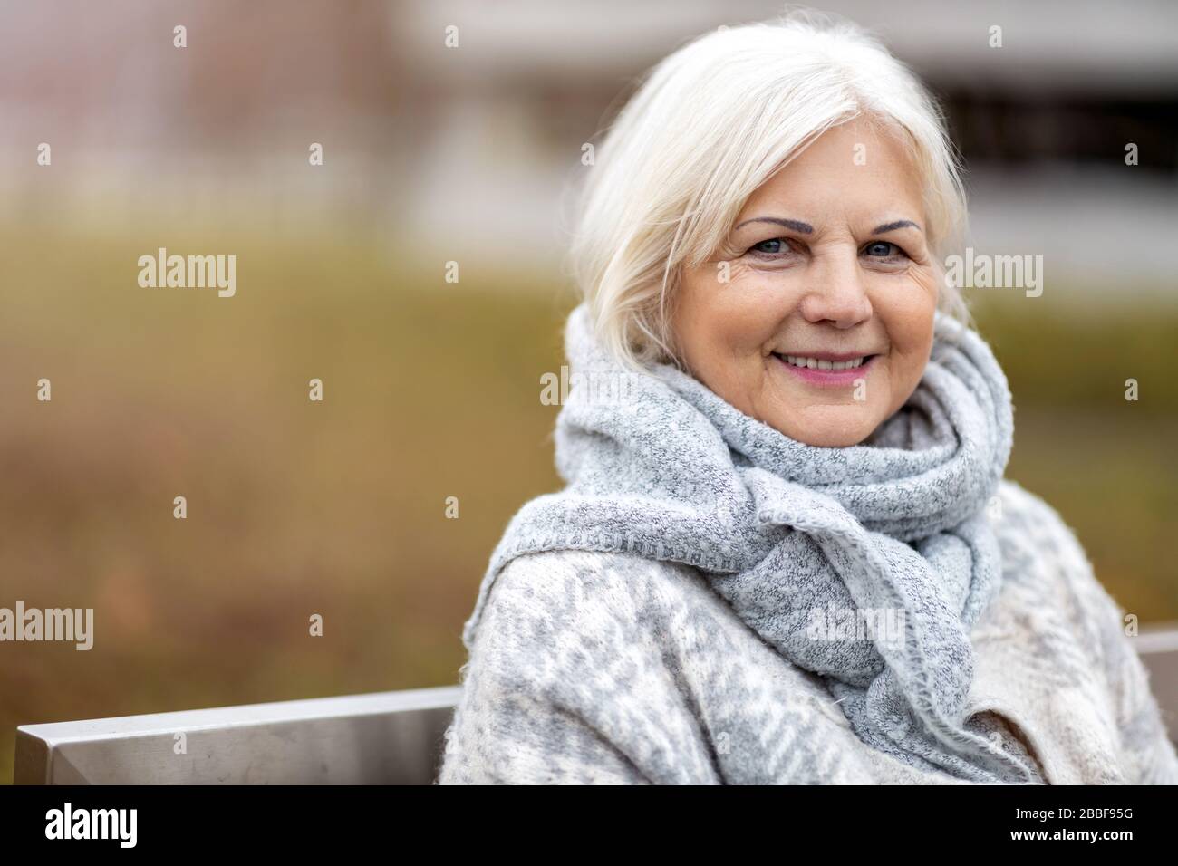 Portrait of senior woman smiling Stock Photo - Alamy