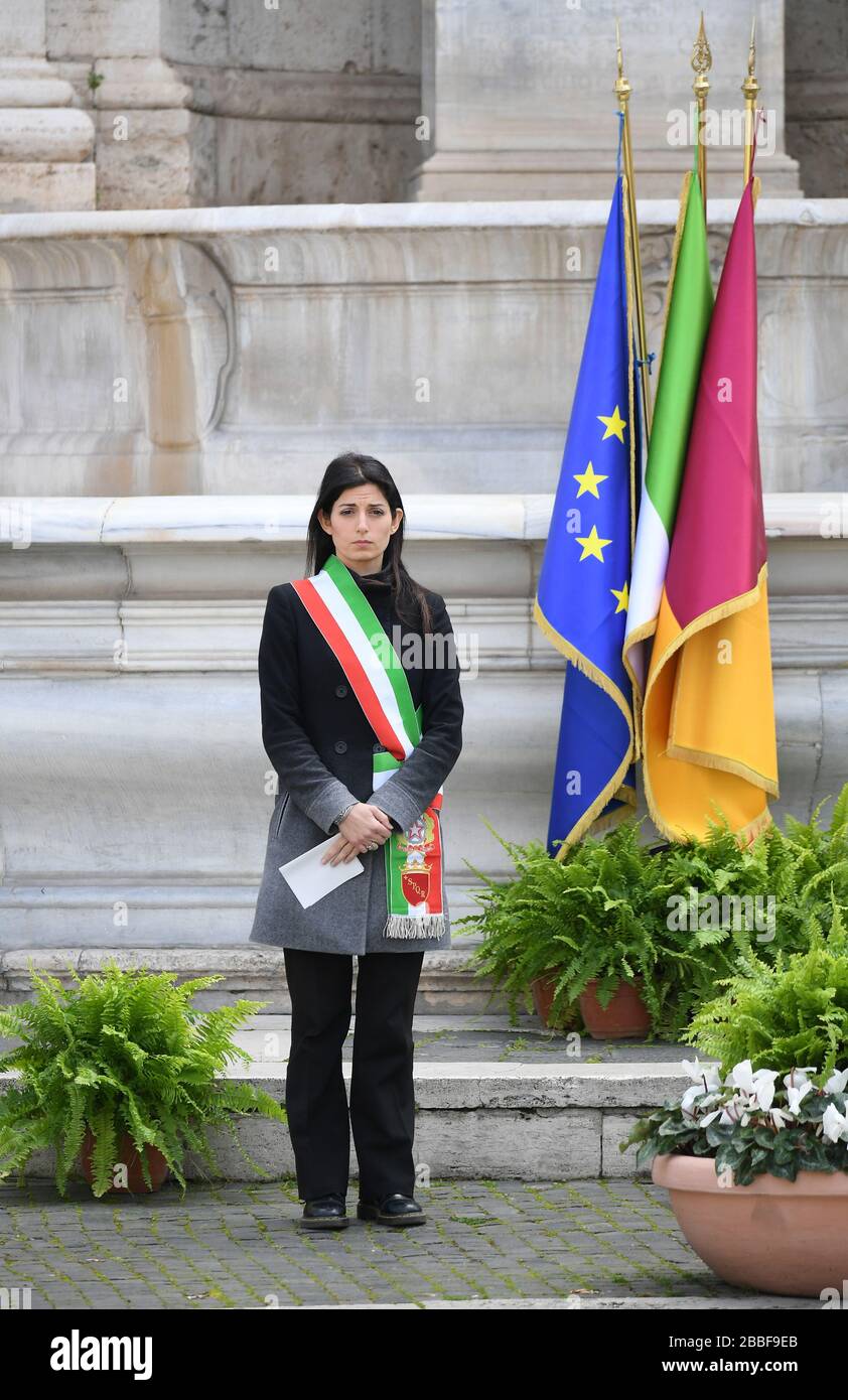 Rome, Italy. 31st Mar, 2020. Mayor of Rome Virginia Raggi attends a memorial ceremony to mourn the country's dead due to coronavirus disease (COVID-19), in Rome, Italy, March 31, 2020. The coronavirus pandemic claimed 11,591 lives in locked-down Italy up to Monday, as the cumulative number of cases reached 101,739, according to the latest data by the Civil Protection Department. Credit: Alberto Lingria/Xinhua/Alamy Live News Stock Photo