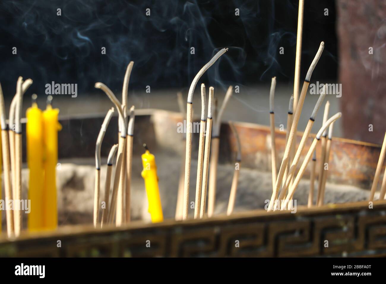 Close up burning incense sticks and smoke from incense burning.Incense