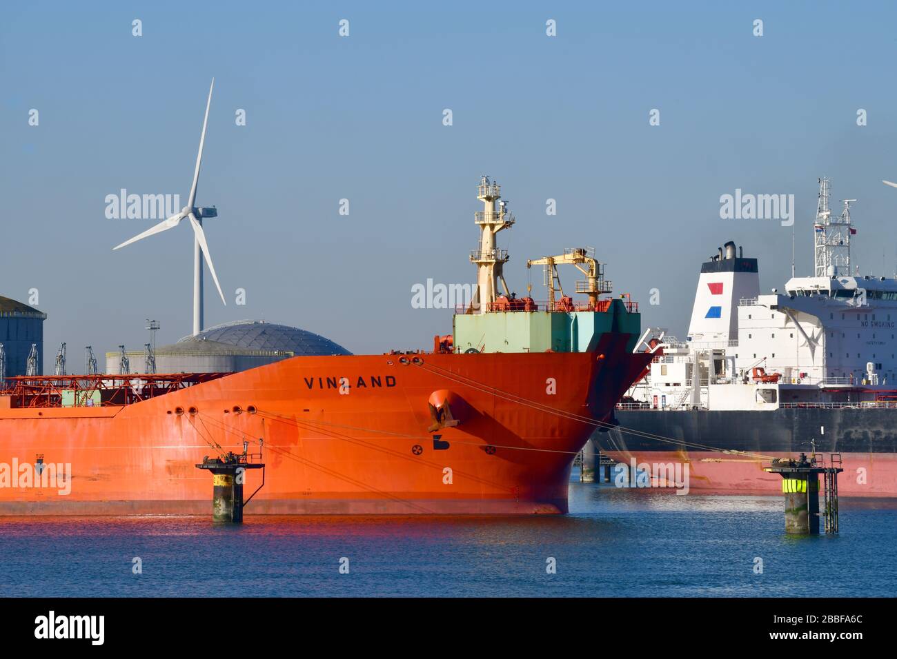 Rotterdam, The Netherlands-March 2020: Bow and stern view of docked Chemical and Oil Products Tankers in the 7th petroleum harbor with a tank farm and Stock Photo
