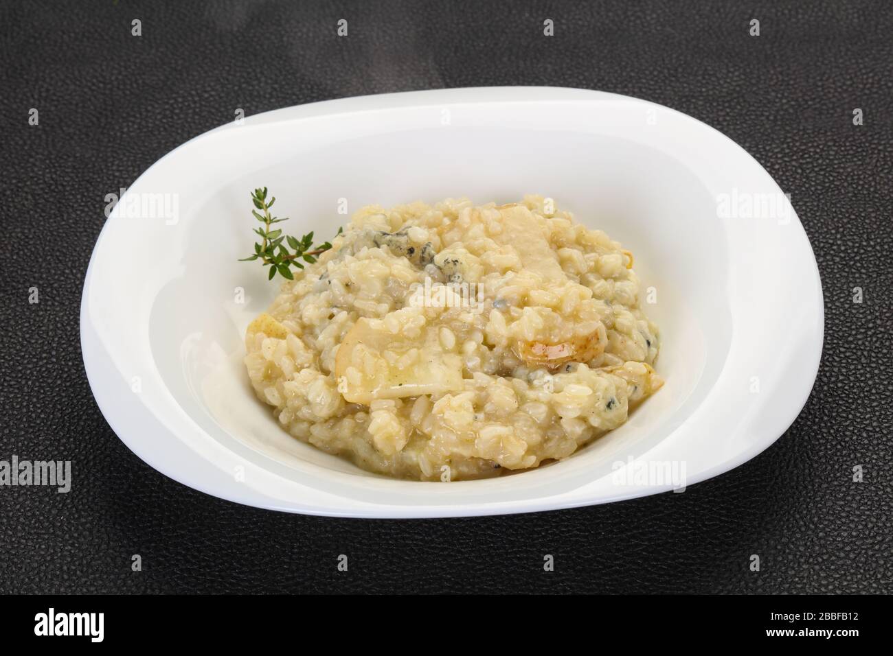Risotto with pear and cheese Stock Photo Alamy