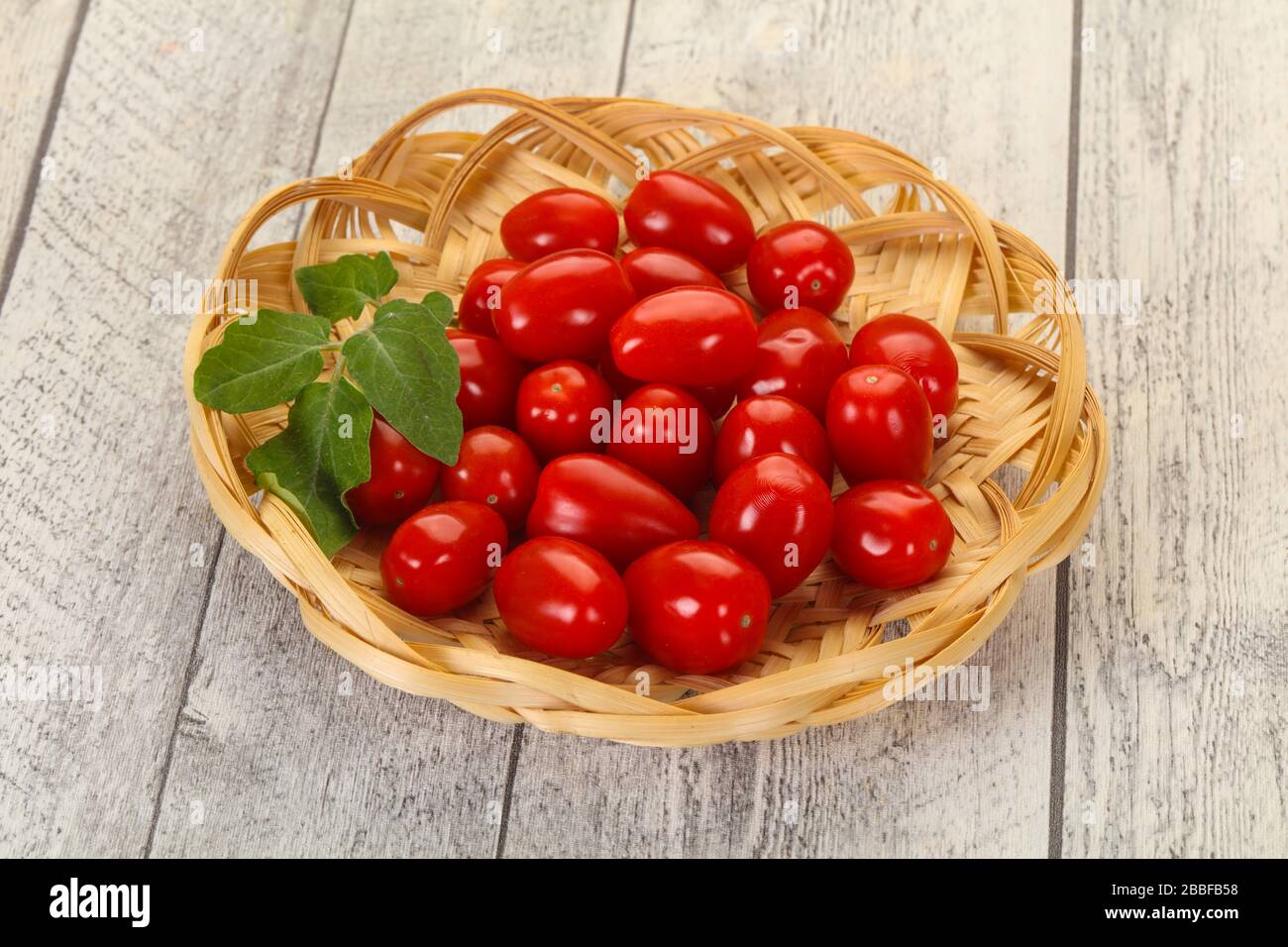 Sweet Red cherry tomatoes in the bowl Stock Photo - Alamy