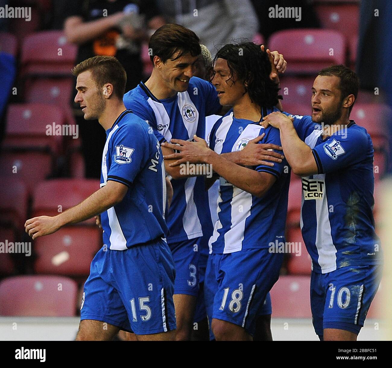 Wigan Athletic's Roger Espinoza (2nd right) is congratulated by team mates after scoring the opening goal against Swansea City. Stock Photo