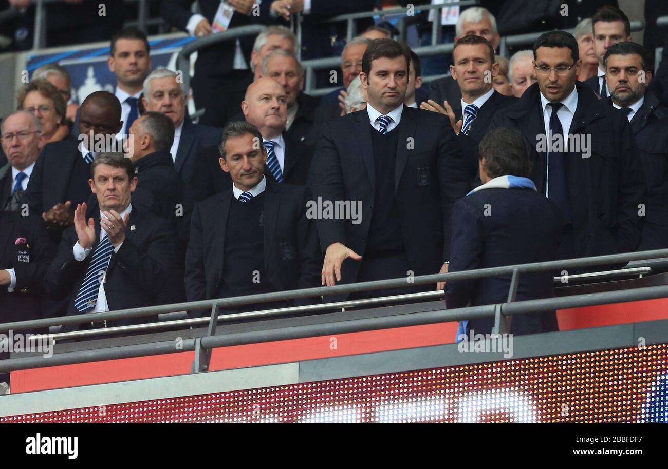 Manchester City Manager Roberto Mancini Walks Past Chief Executive Ferran Soriano Centre As Chairman Khaldoon Al Mubarak Right Director Of Football Txiki Begiristain 3rd Right And Former Football Administrator Brian Marwood Far Manchester City Manager Roberto Mancini Walks Past Chief Executive Ferran Soriano Centre As Chairman Khaldoon Al Mubarak Right Director Of Football Txiki Begiristain 3rd Right And Former Football Administrator Brian Marwood Far