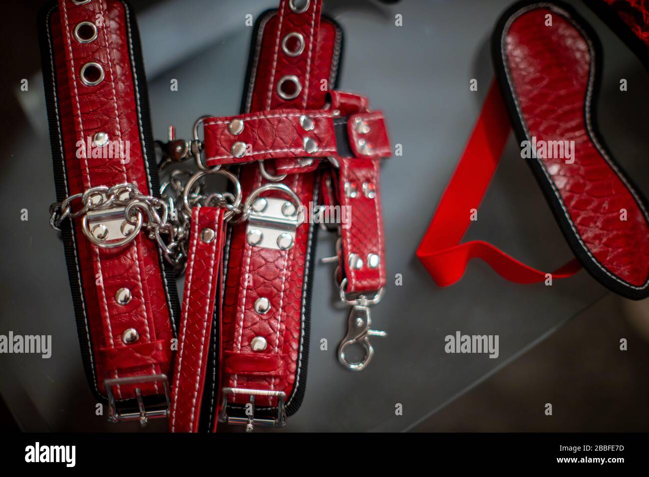 Sexual kink and erotic games concept. Complete sex toy kit set - cuffs,  collar and leash for BDSM fantasy play and bondage restraints Stock Photo -  Alamy