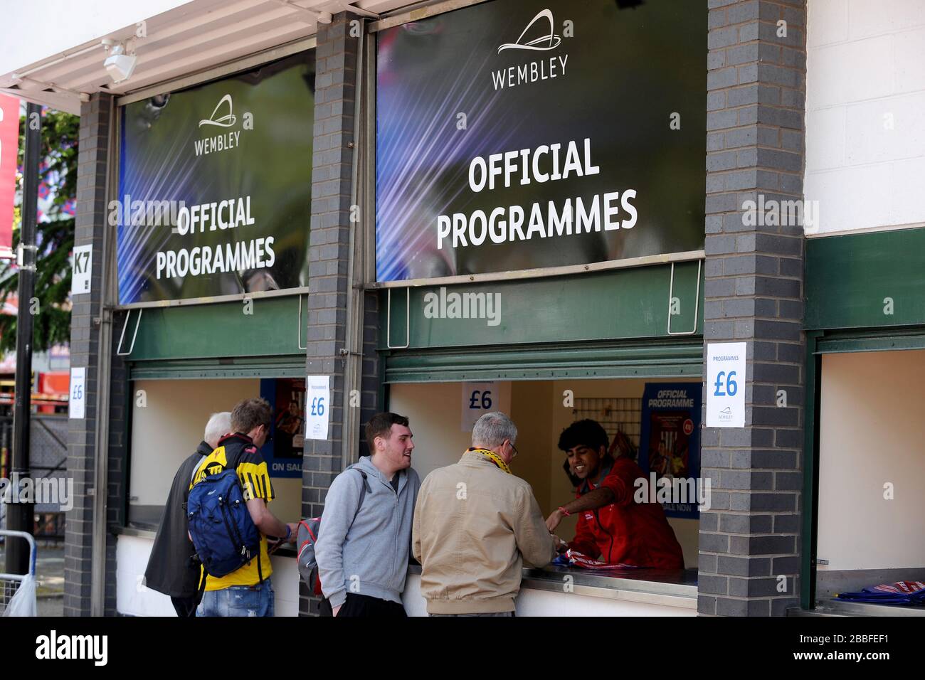 Programme Seller An official programme seller outlet outside Wembley Stock Photo - Alamy
