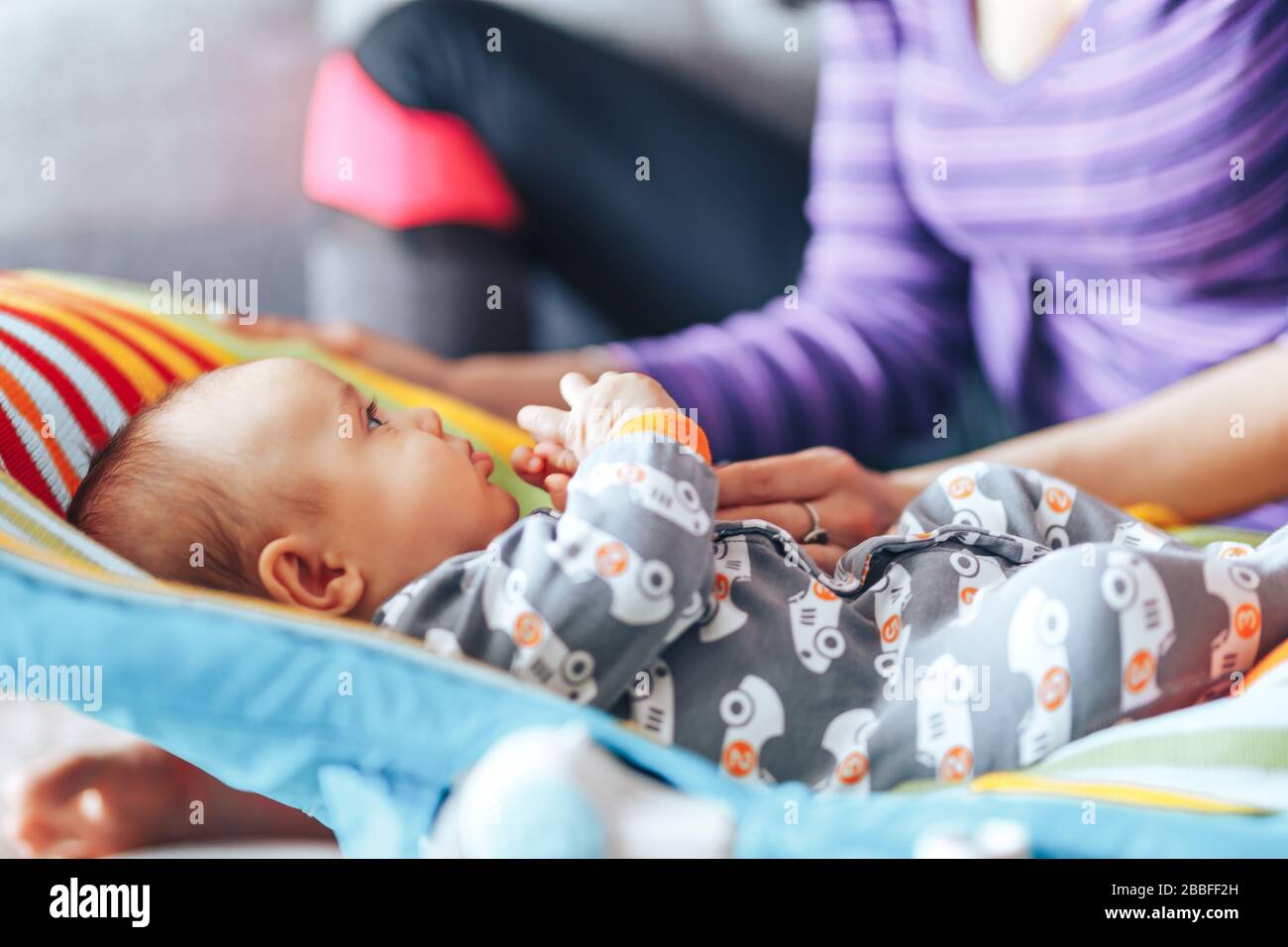 beautiful mother with newborn cute baby at home Stock Photo