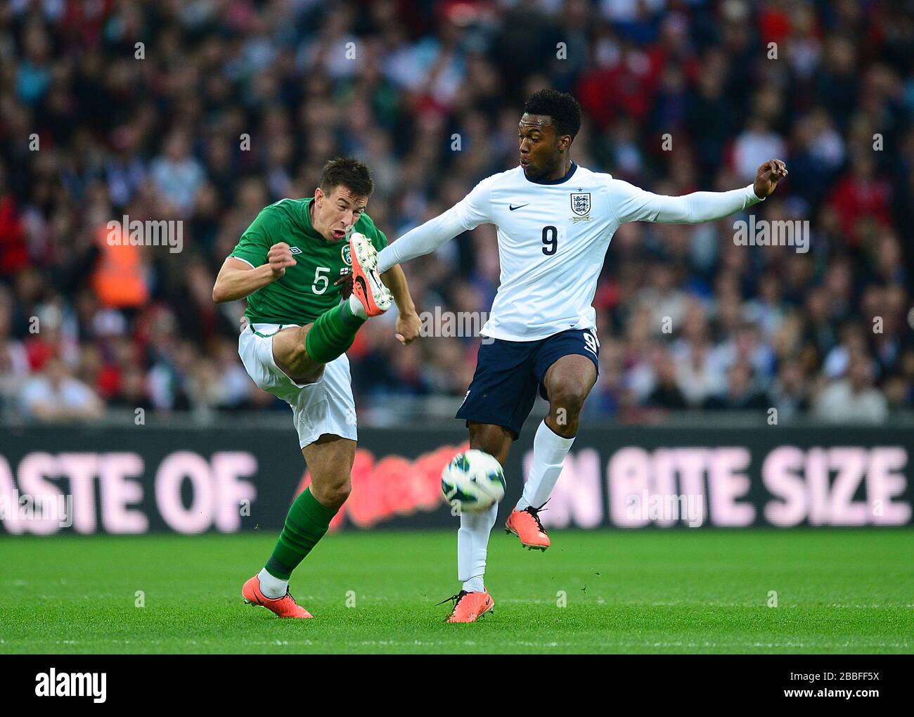 England's Daniel Sturridge (right) and Republic of Ireland's Sean St. Ledger (left) in action Stock Photo