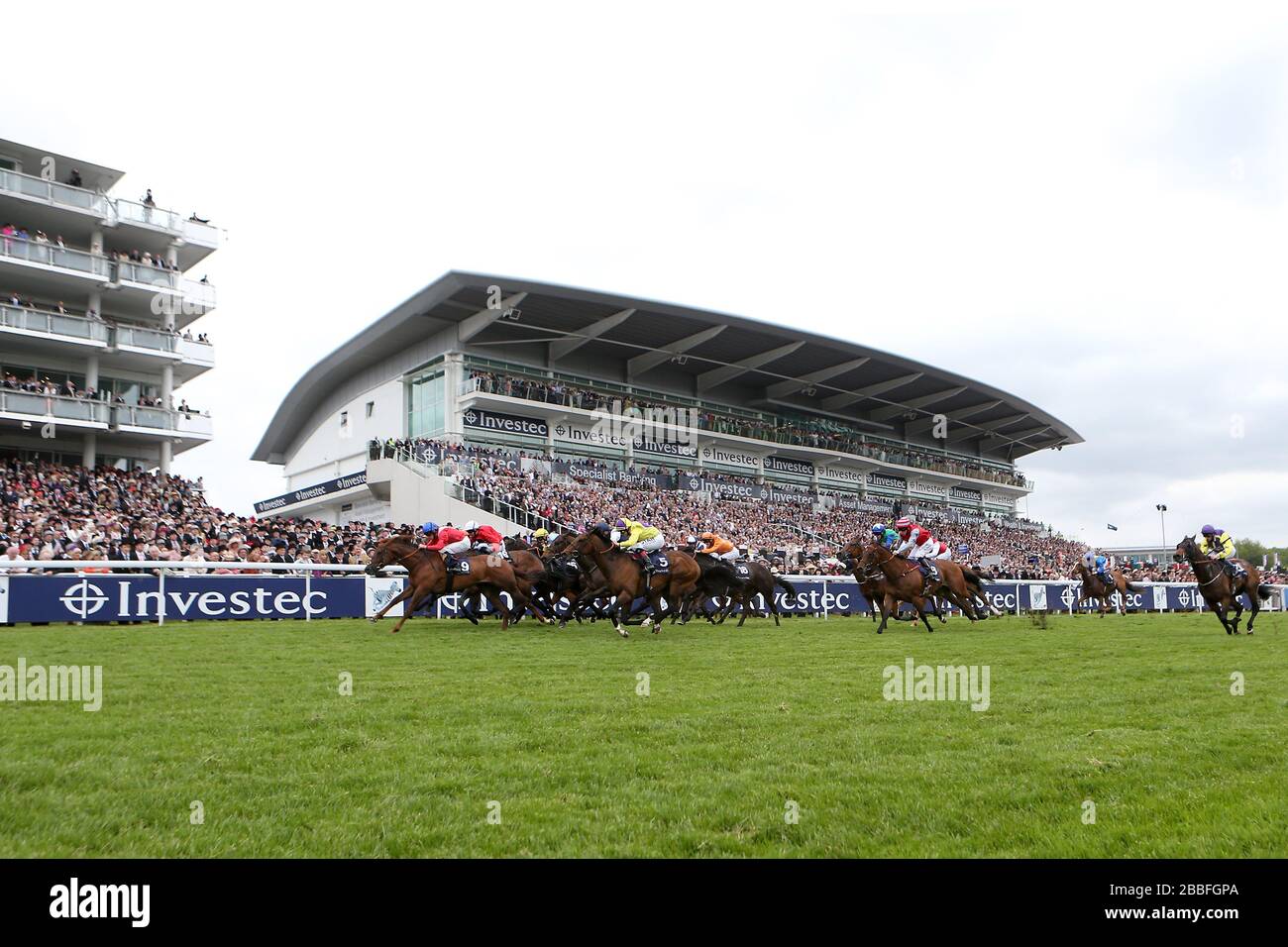Duke of Firenze (left) ridden by Ryan Moore comes home to win The Investec Specialist Bank 'Dash' Stock Photo