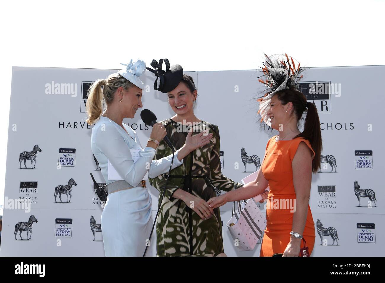 Winner of the What Best to Wear competition, in partnership with Harvey Nichols, Leigh Johnson from Chichester (right) celebrates her win alongside Channel 4 Commentator Emma Spencer (far left) and Paula Reed, Group fashion director at Harvey Nichols Stock Photo