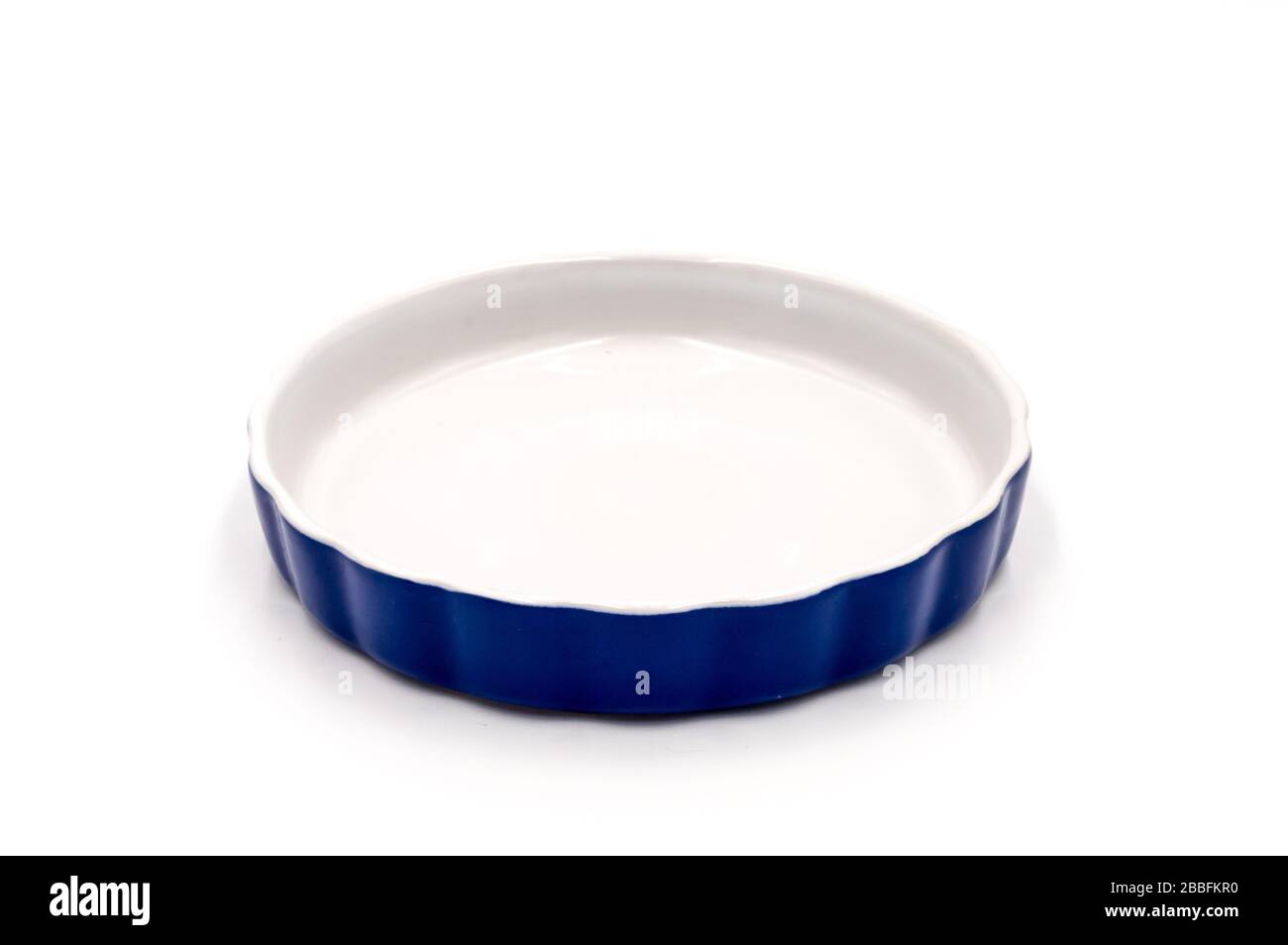 Blue porcelain ramekin on a white background Stock Photo