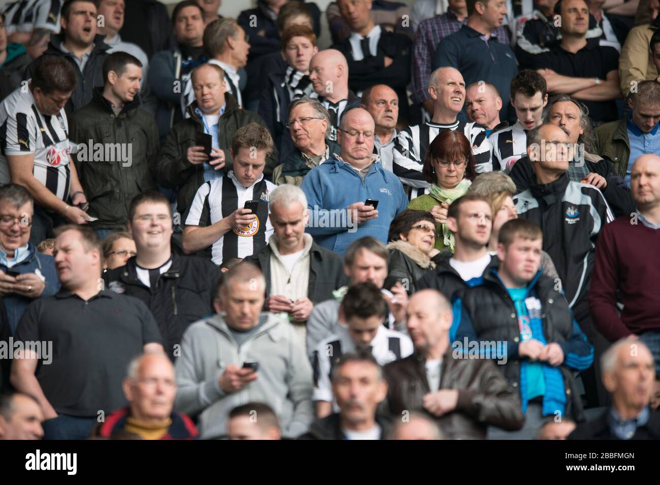 Newcastle united fans in the stands at st james park hires stock