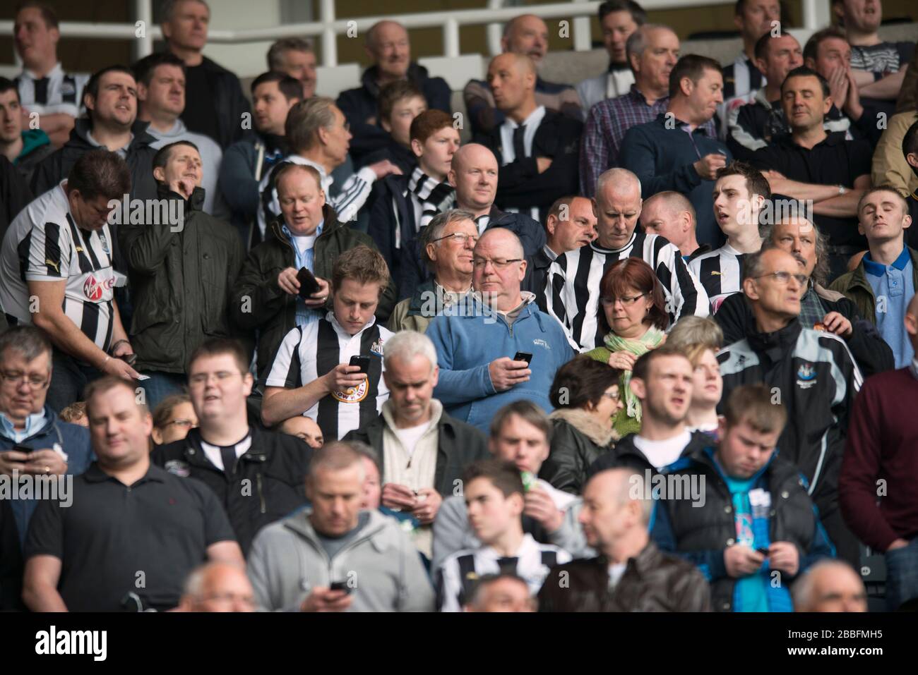 Newcastle united fans in the stands at st james park hires stock