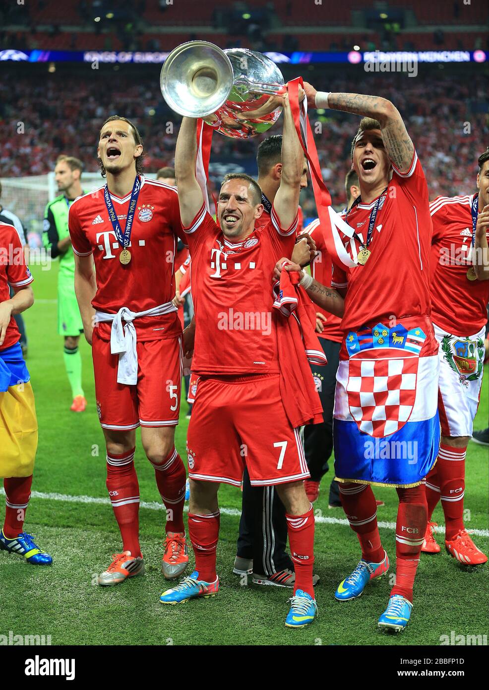 Bayern Munich's Franck Ribery celebrates with the Champions League trophy on the pitch Stock Photo