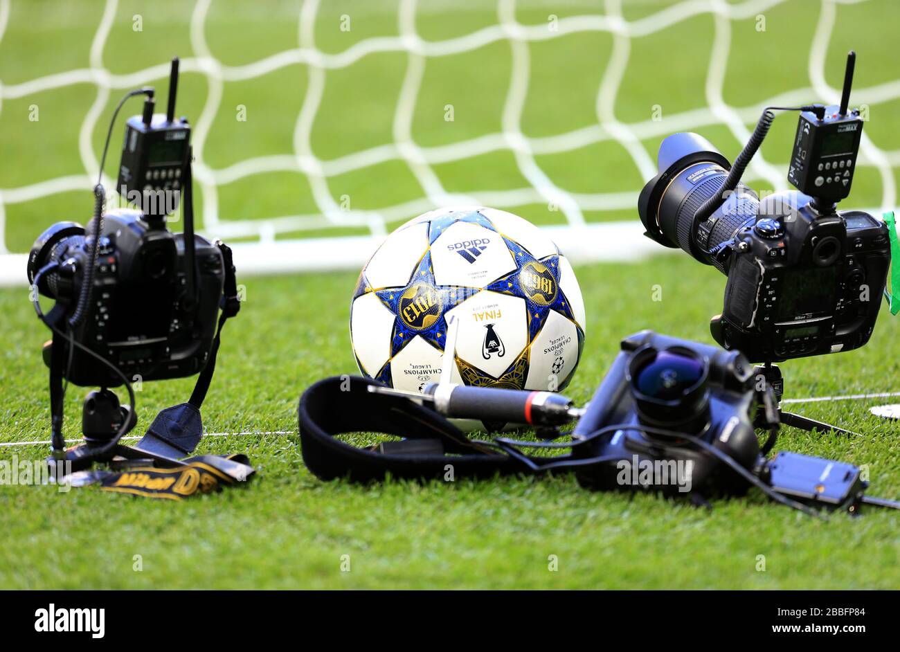 A UEFA Champions League final match ball surrounded by remote cameras pitch side Stock Photo