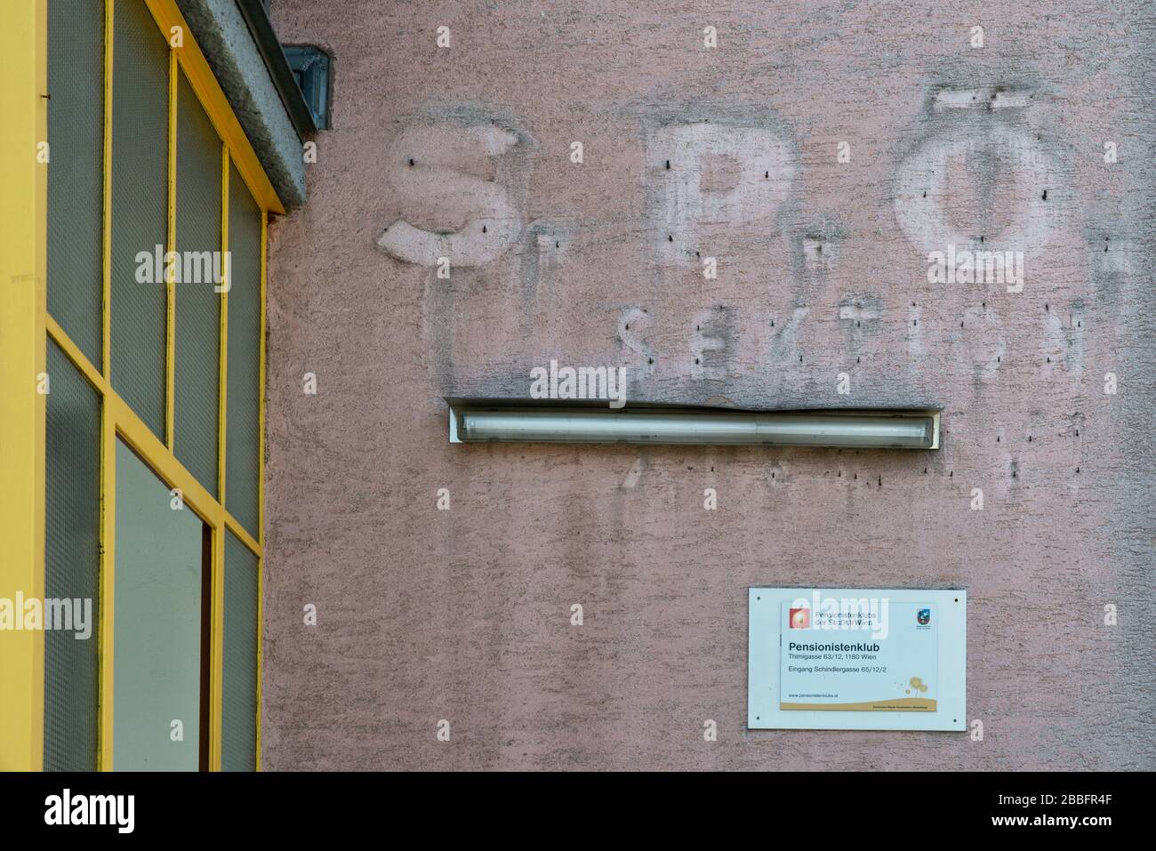 faded sign of SPÖ Socialist Party Austria on pink wall Stock Photo