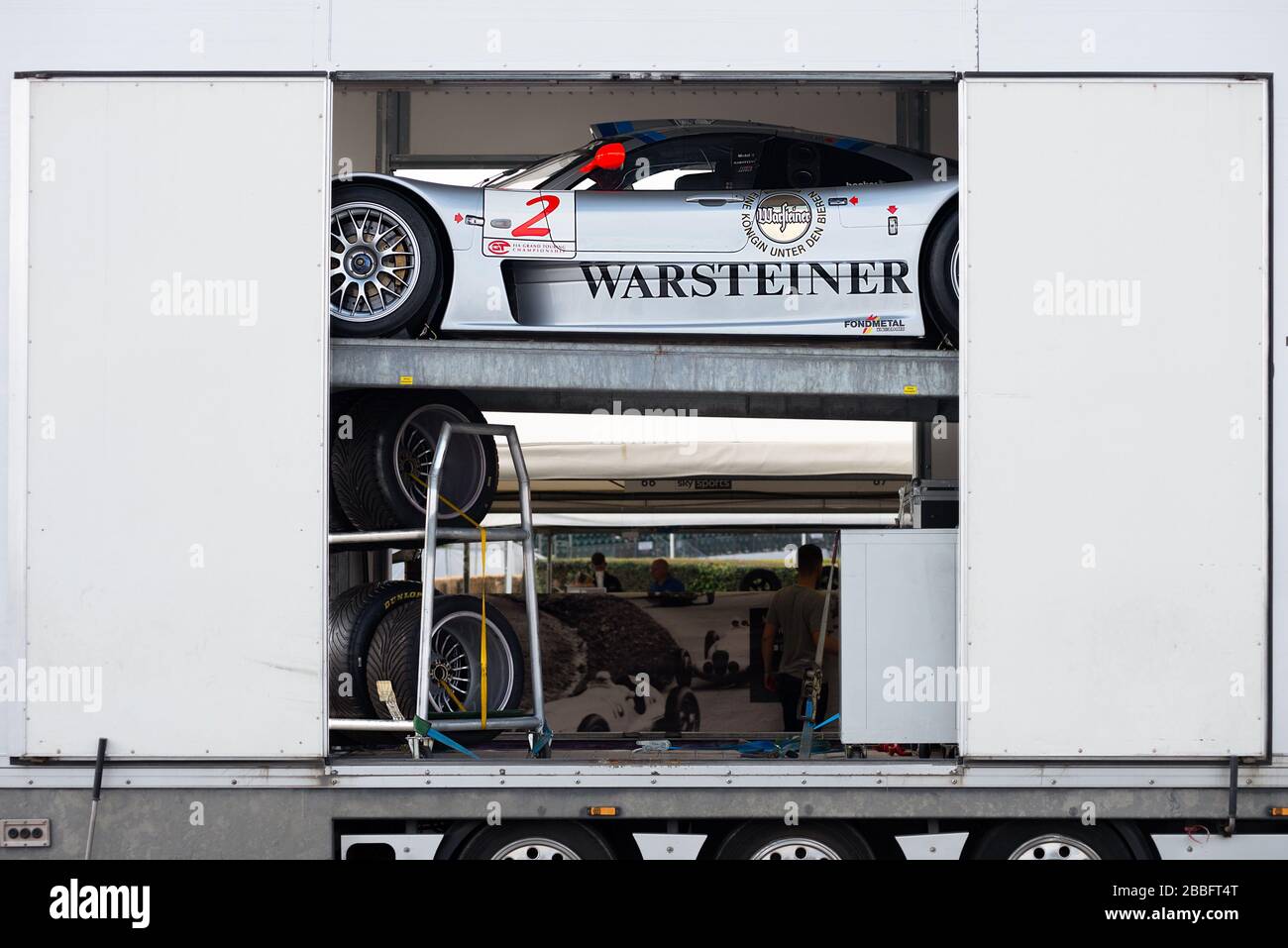 A Mercedes-AMG CLK GTR race car is unloaded from a car transporter at the Goodwood Festival of  Speed. Stock Photo