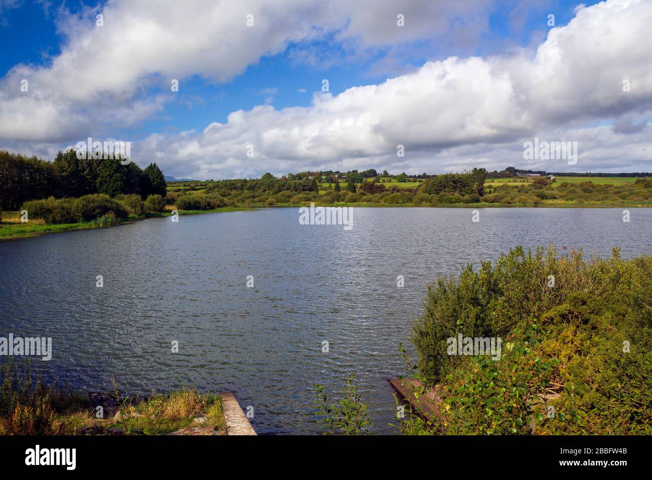 Picturesquely located water reservoir nestled among the hills. Stock Photo