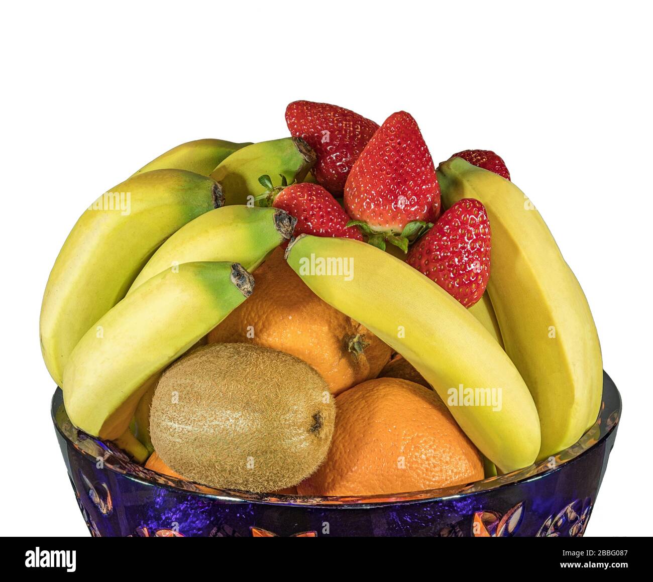 Fresh tropical and subtropical fruits in a large blue crystal vase