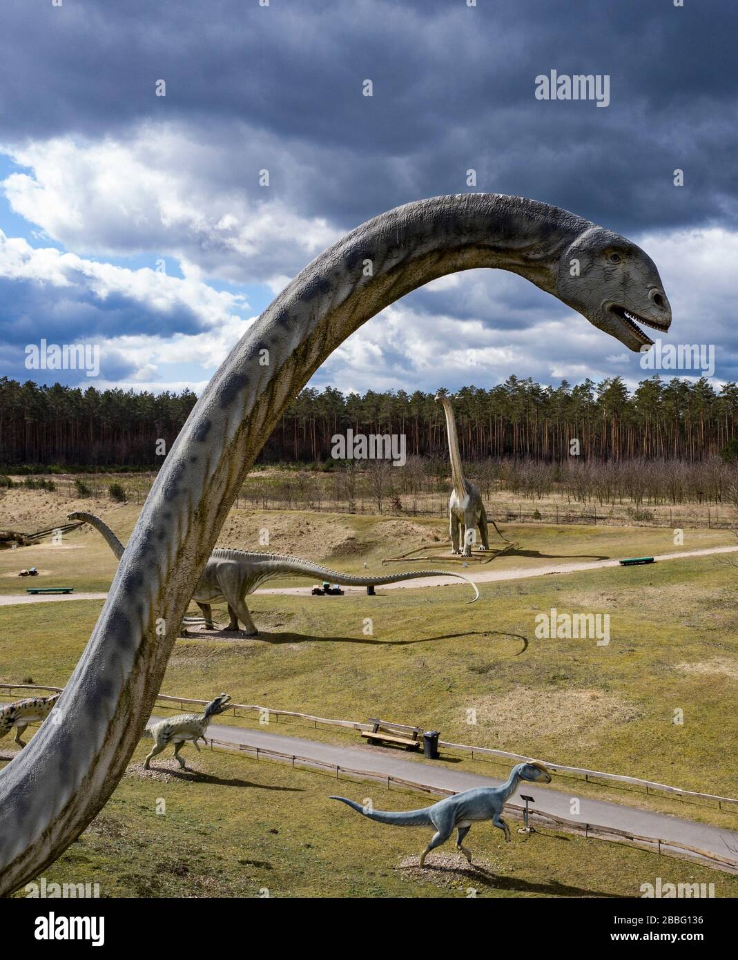 31 March 2020, Brandenburg, Germendorf: Oversized dinosaur figures can be found in the Dinopark Germendorf (Brandenburg). Due to the corona crisis this animal and leisure park is also closed. Numerous employees are now on short-time work. Photo: Paul Zinken/dpa-zb-Zentralbild/dpa Stock Photo
