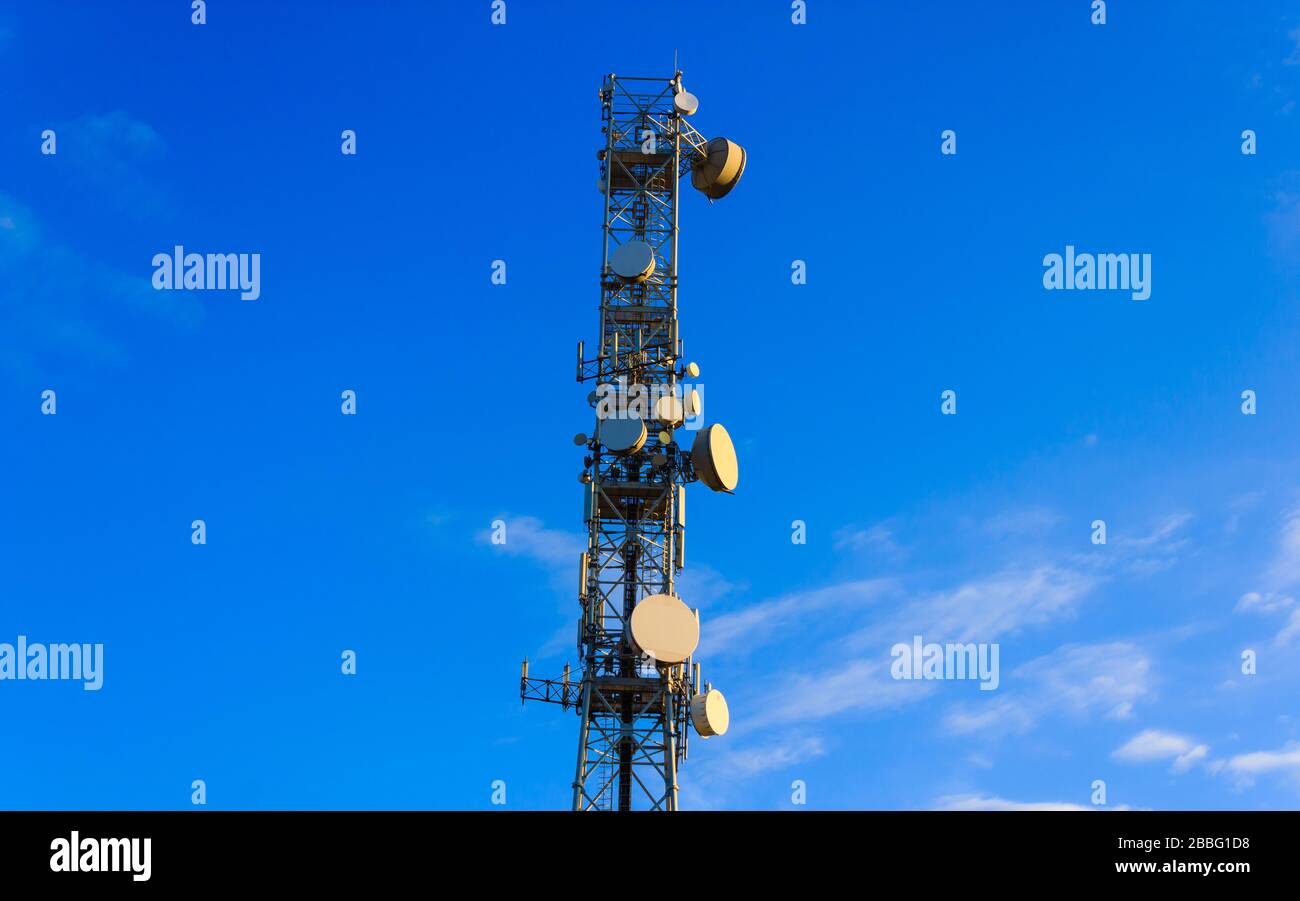 tower with  control devices and antennas, transmitters and repeaters for mobile communications and the Internet Stock Photo