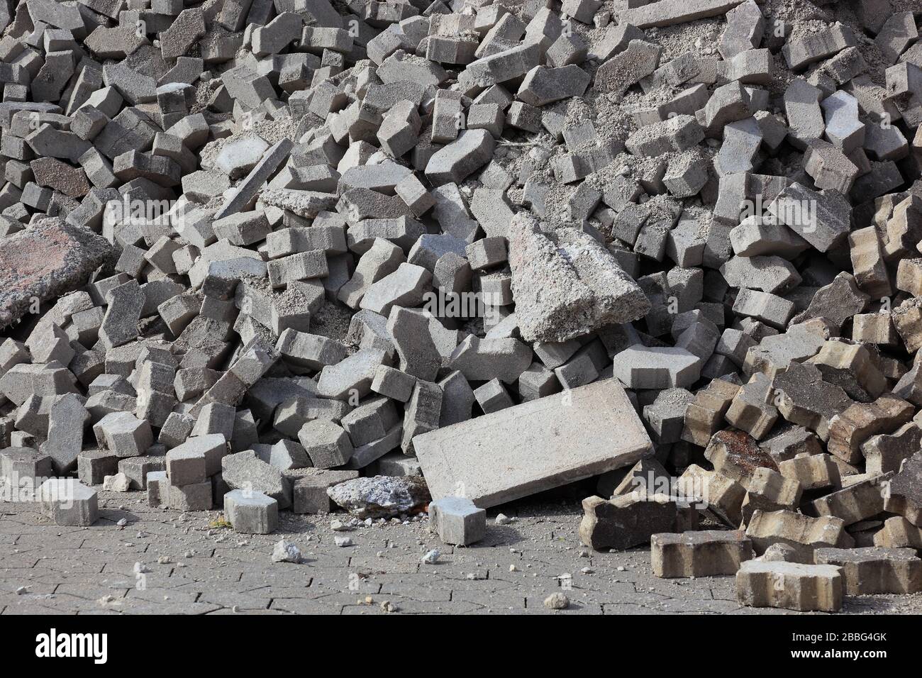 Demolition of an old paved area of an industrial wasteland, torn out paving stones   /  Abriß einer alten Pflasterfläche einer Industriebrache, heraus Stock Photo