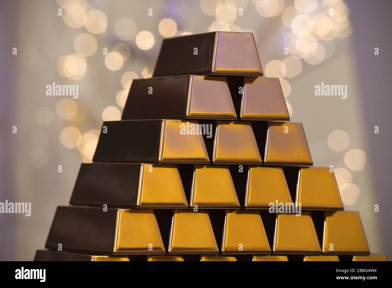 Gold ingots stacked in pyramid Stock Photo