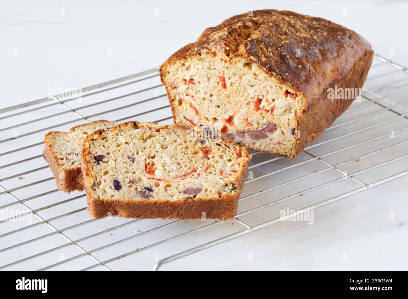 Homemade Red Pepper and Olive savoury cake. Stock Photo