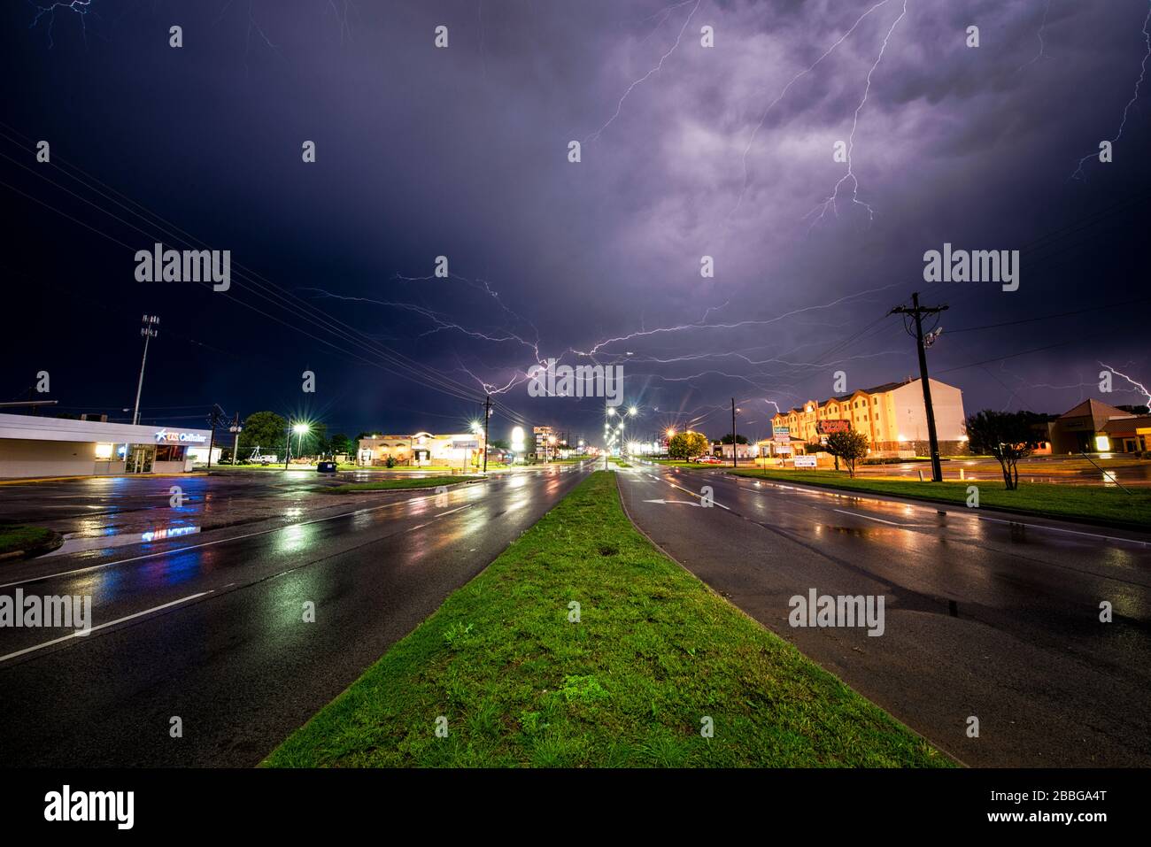 Storm with lightning strikes over city roads in Oklahoma City Oklahoma United States Stock Photo