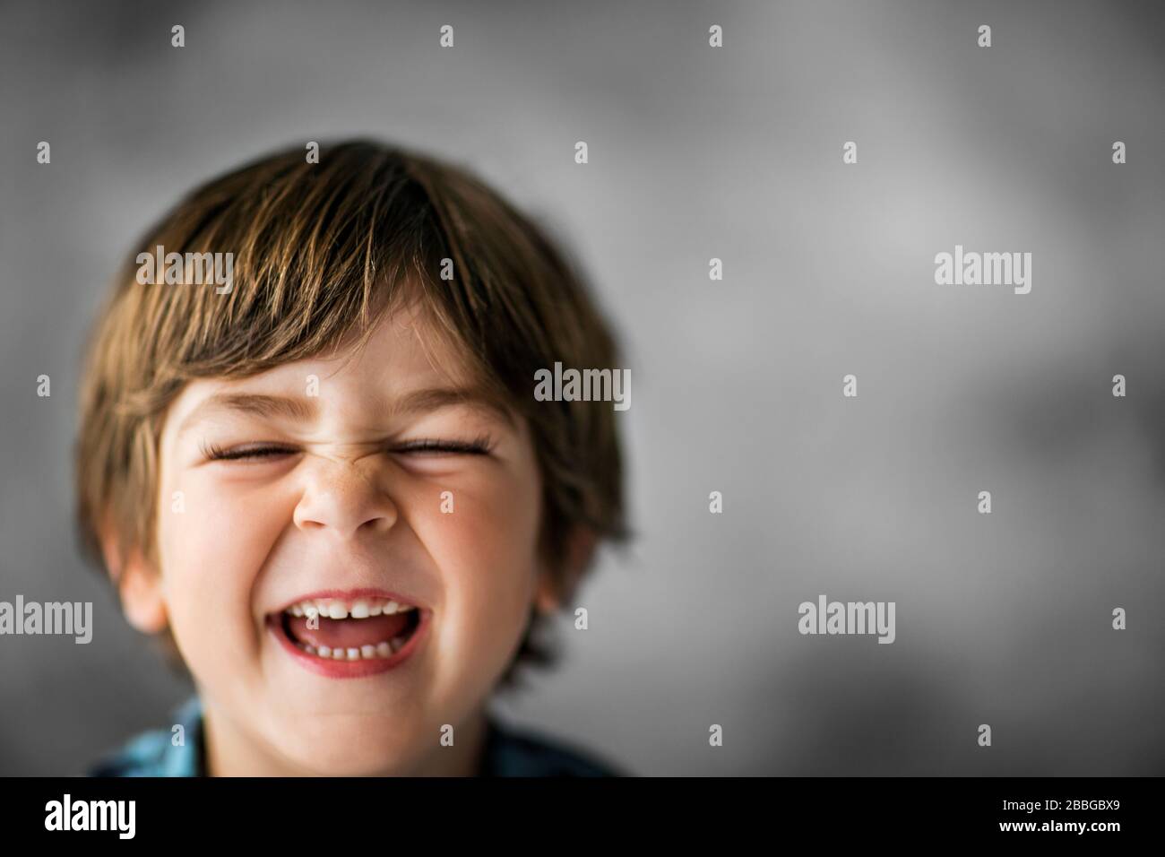 Portrait of a happy young boy making a funny face Stock Photo