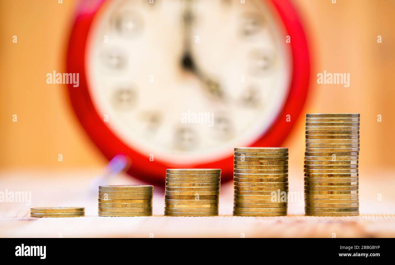 Benefits of compound interest concept money coins, growing Stock