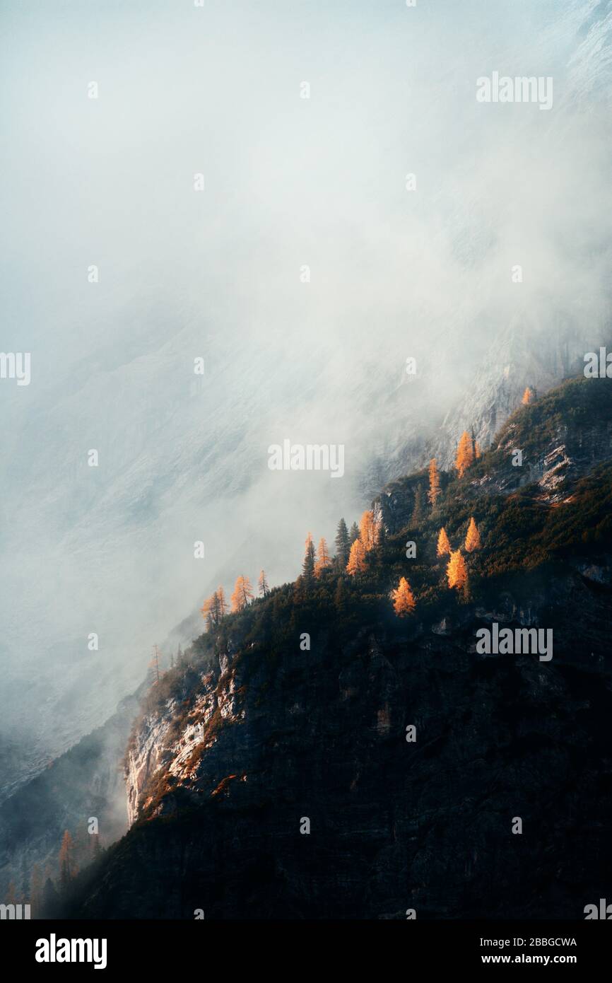 Dolomites natural landcape in fog in North Italy Stock Photo - Alamy