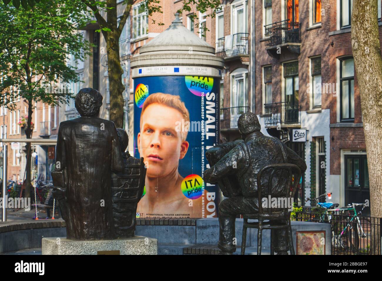 Musician statues and a poster for ITA Pride on the Elandsgracht in Amsterdam, Netherlands, Europe Stock Photo