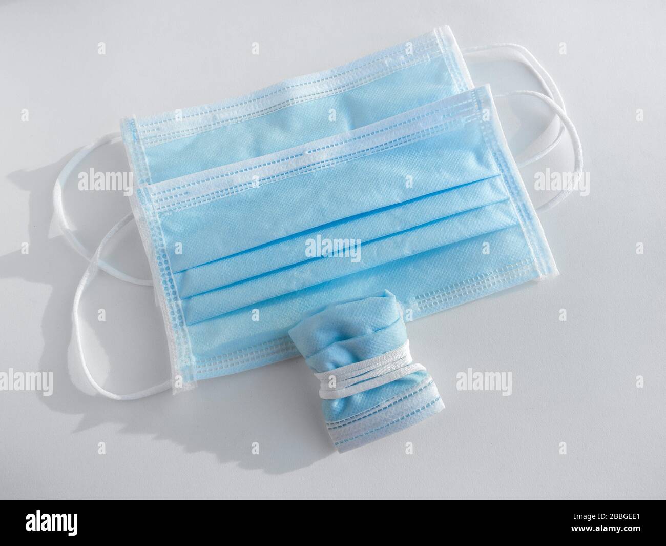 Used mask concept. Protective face masks and folded used face mask isolated on white background