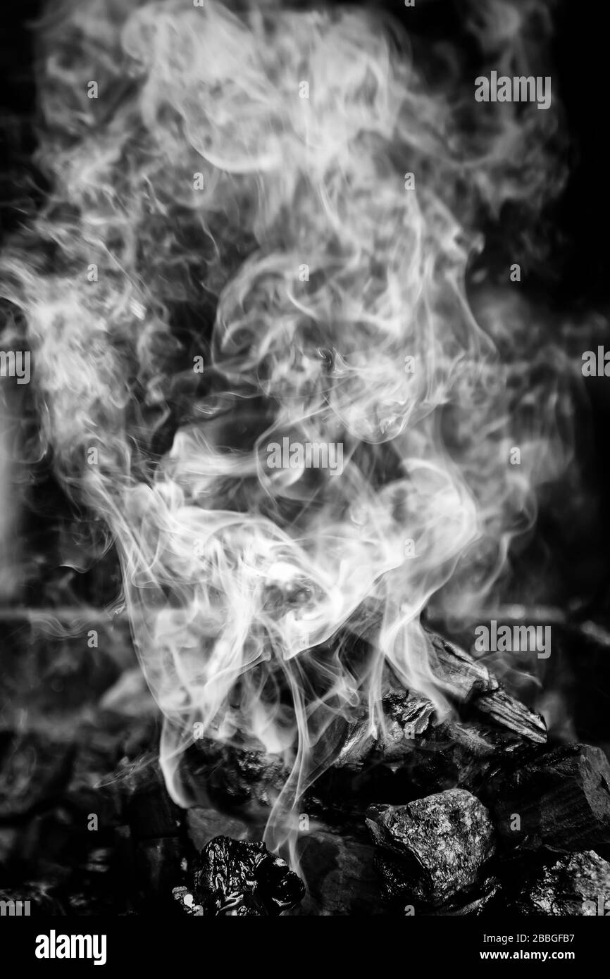 Smoke on embers of fire, heat and magic Stock Photo