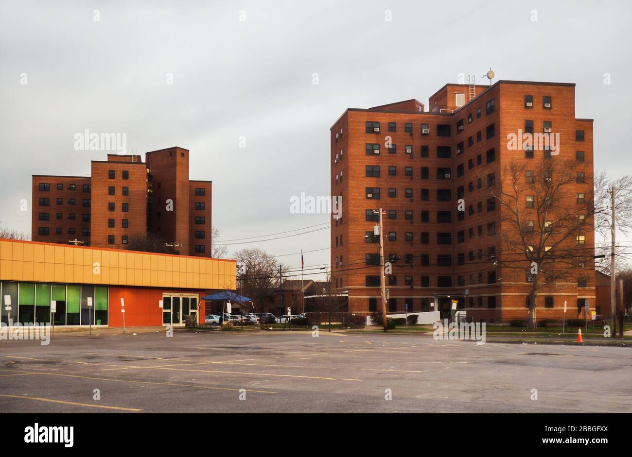 Low income housing units and closed and vacant grocery store in a city Stock Photo