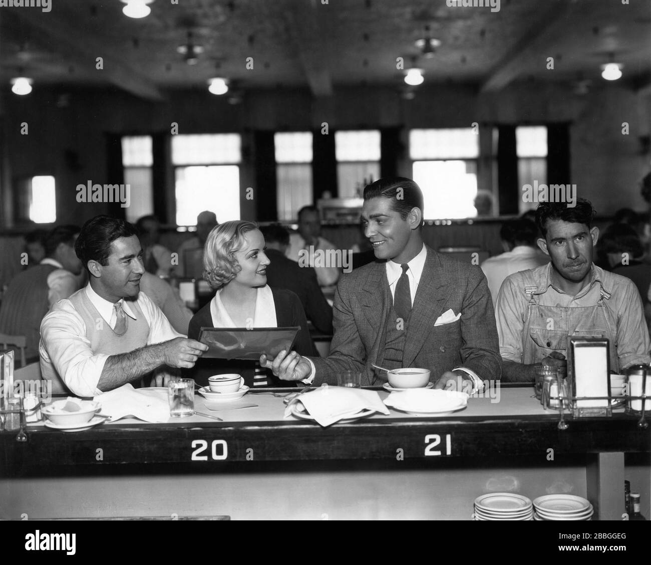 CLARK GABLE and CAROLE LOMBARD studio candid at Paramount's Lunch Counter during filming of NO MAN OF HER OWN 1932 director WESLEY RUGGLES Paramount Pictures Stock Photo