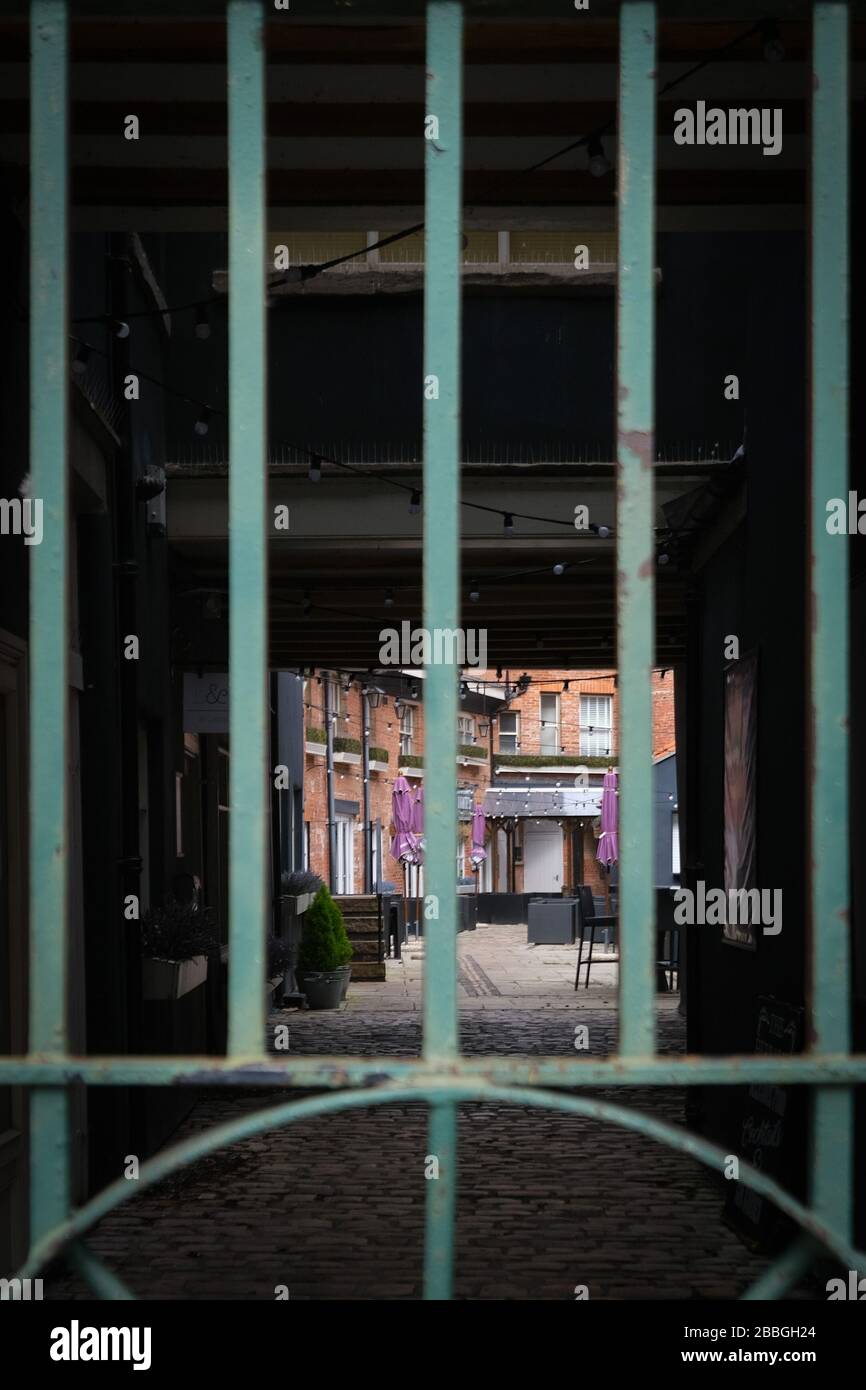 A UK pub beer garden sits behind bars during the Coronavirus Covid-19 outbreak. Stock Photo