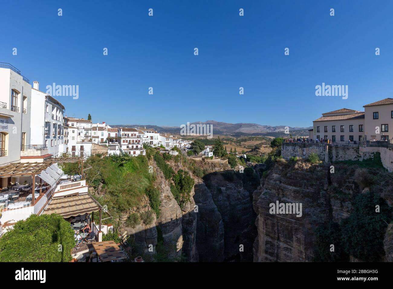 View into the gorge El Tajo in Ronda, one of the famous white towns of Andalusia, Spain. Stock Photo