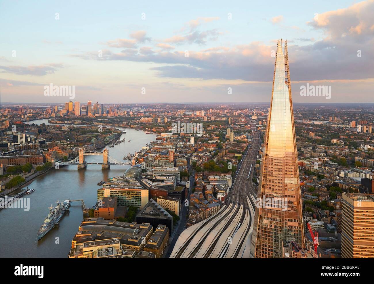 The Shard with Thames and Canary Wharf beyond at sunset. 52 Lime Street - The Scalpel, London, United Kingdom. Architect: Kohn Pedersen Fox Associates Stock Photo