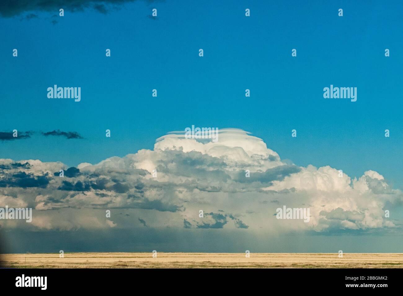 Storm from far away with pileus could over rural field in souther Manitoba, Canada Stock Photo