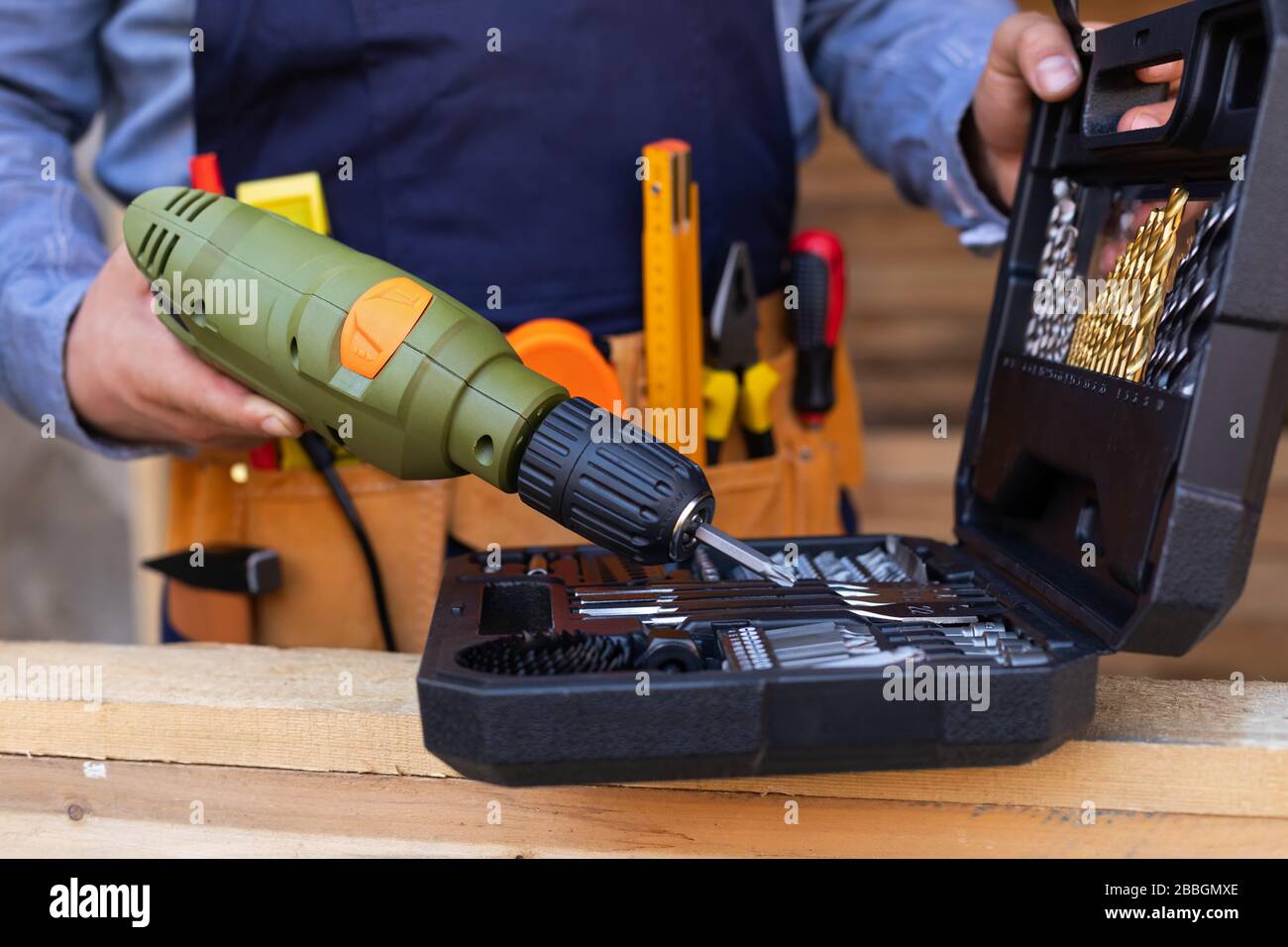 Close up picture of carpenters tool belt and work instruments on wooden ...